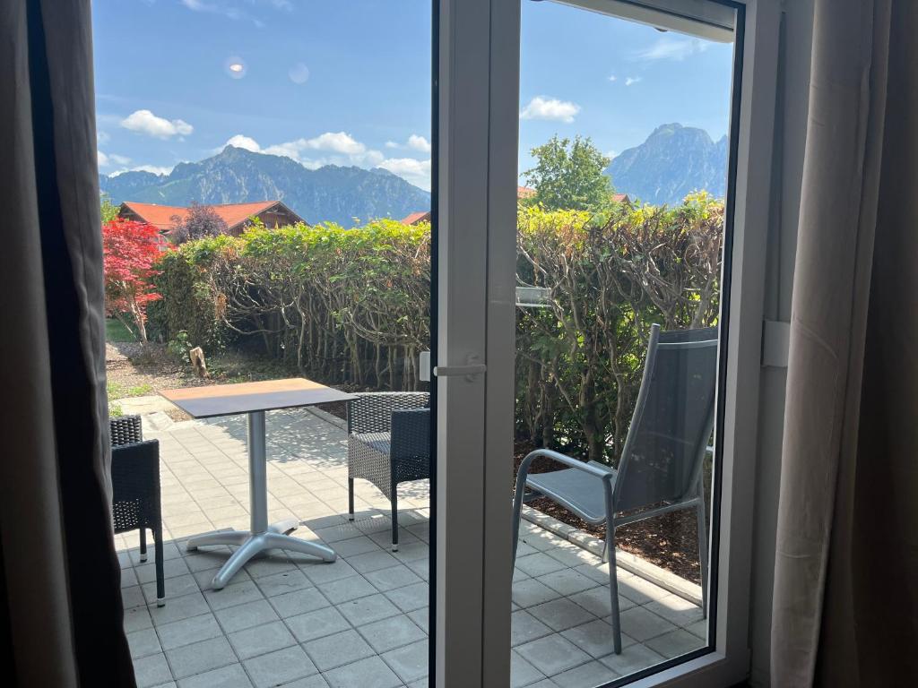 Familienzimmer mit Terrasse – Gästehaus Forggensee